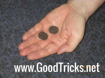 Hand is opened to revel only two coins.