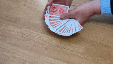 Speading the cards in a natural manner.