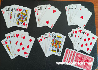 Each players hand is turned over to reveal a full house winning hand.