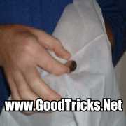 Image of coin being placed into a handkerchief.