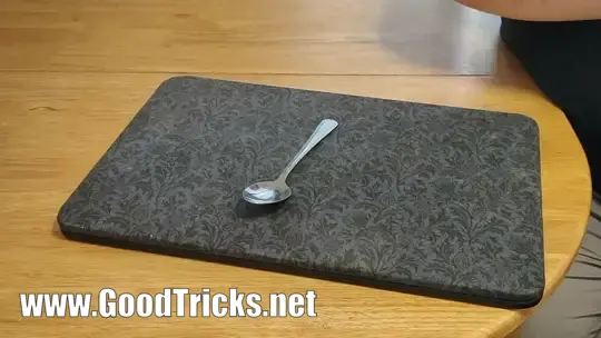 A metal spoon is bent back and forward as if it is made of rubber.