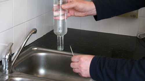 Insert toothpick in bottle
