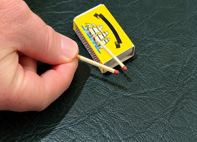 Two matchsticks positioned for the jumping match trick