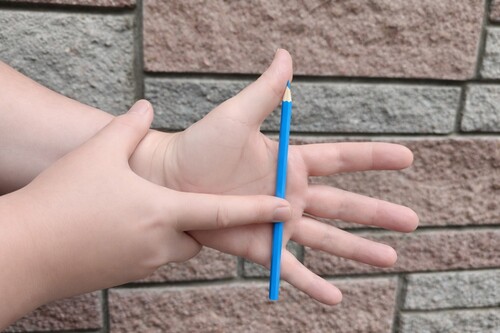 Secret finger position used to support the levitating pencil