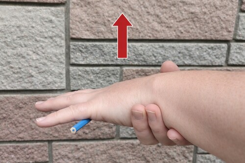 Hand is raised slowly and steadily.