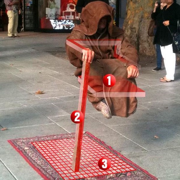 Levitating street performer image.