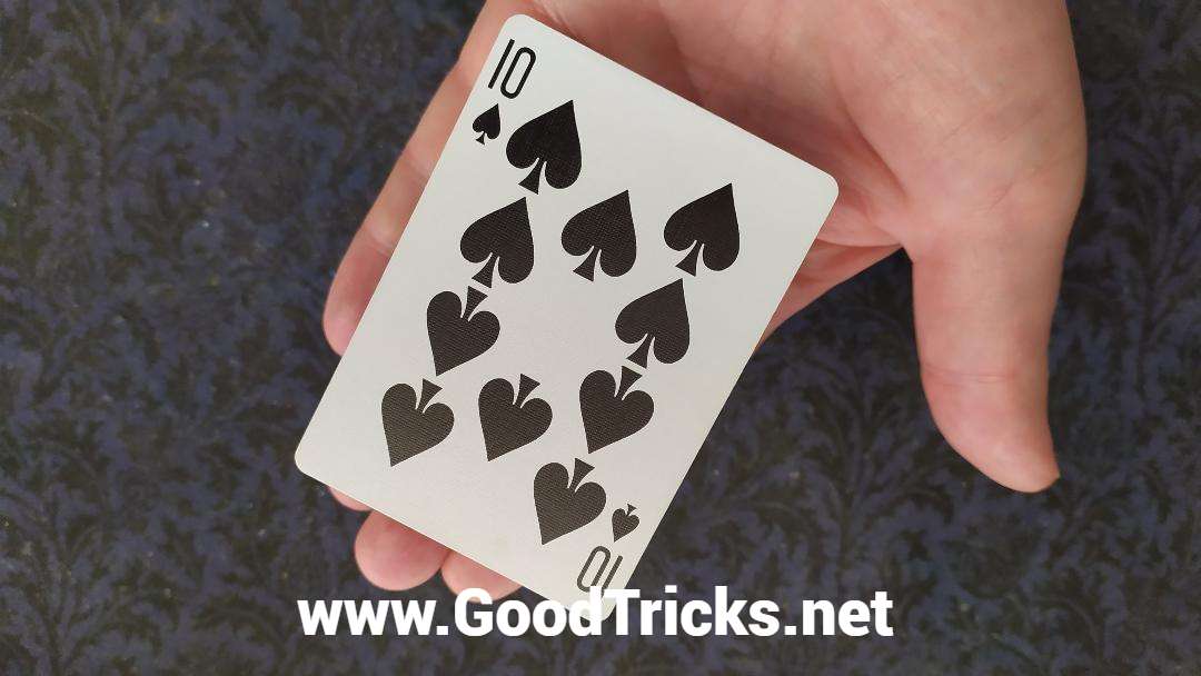 Playing card being made to levitate on a hand.