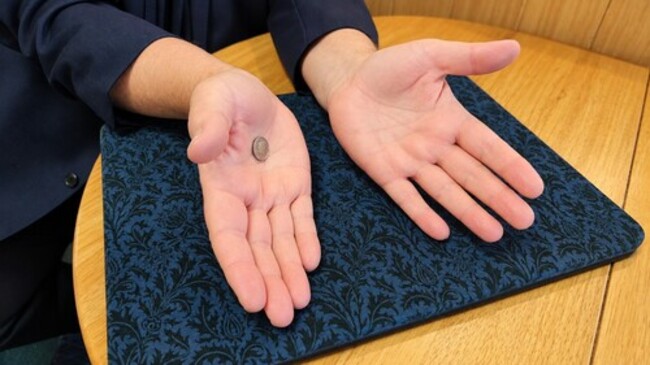 Coin appears from nowhere.