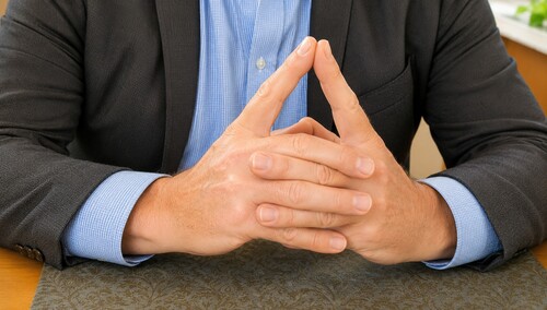 Fingertips are drawn together so that they touch.