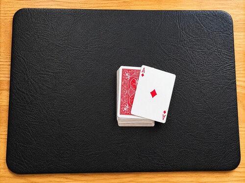 Playing card being dropped and flippedm over.