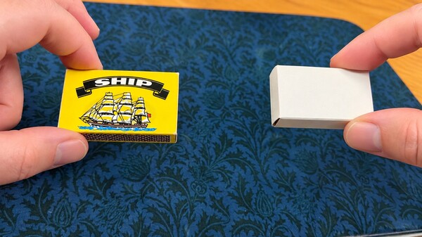 Matchbox opened upside down while the matches remain inside