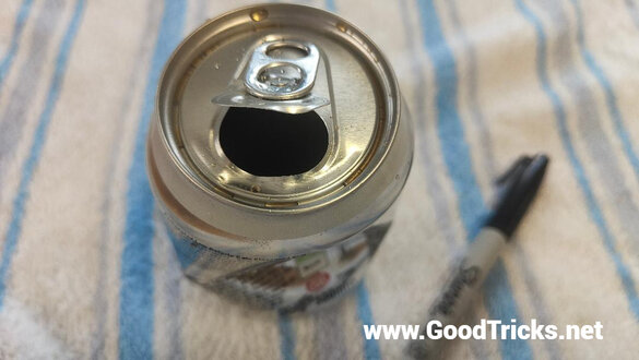 Soda can that has popped open due to internal pressure.