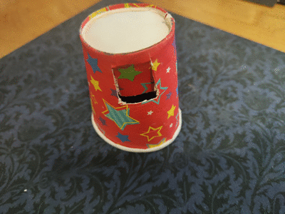 Small flap cut near the base of the paper cup