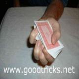 Playing cards held in dealers hand image.