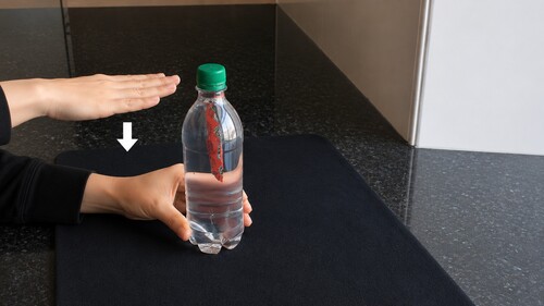 Remote controlling  the movement of a sachet in a sealed bottle.