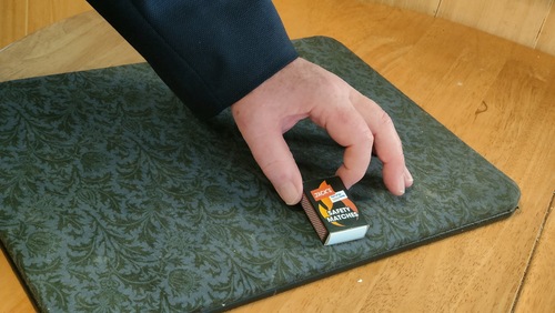 The hidden matchbox covered by a long sleeve