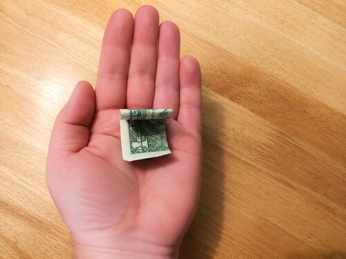 Dollar bill folding by itself