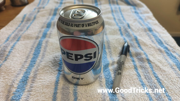 A soda can and a Sharpie pen are the props that you will need.