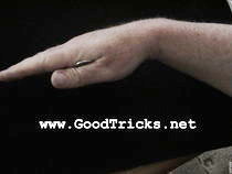 Hide a small coin in your hand between thumb and first finger.