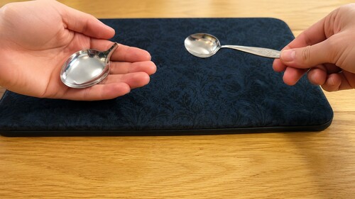 The complete restored spoon being displayed while the gimmick is secretly concealed