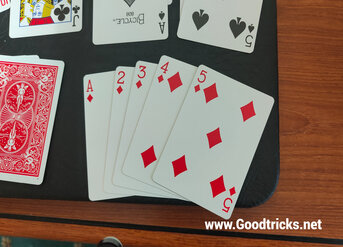 Top five cards turned over to reveal a straight flush.