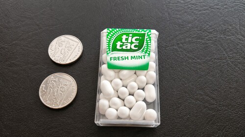 Two coins and a Tic Tac box
