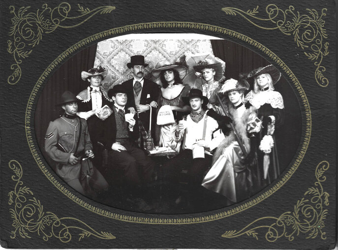 Old wild west style photo showing gamblers and town folk.