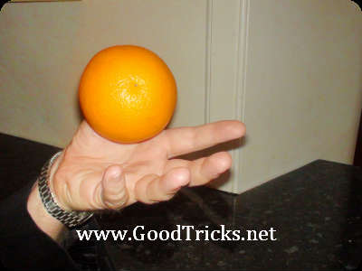 Move thumb up and down to make orange appear to levitate.