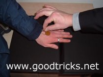 Place a coin on spectators hand. Snap your finger and thumb, above the coin to flick it up your sleeve.