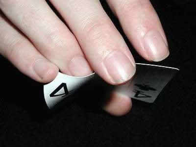 Photo showing move with the bent card during the 3 card monte trick.